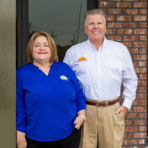 InsureWise Leadership Team at Office Entrance InsureWise leadership team standing outside the office entrance, representing experience and professionalism in commercial insurance.